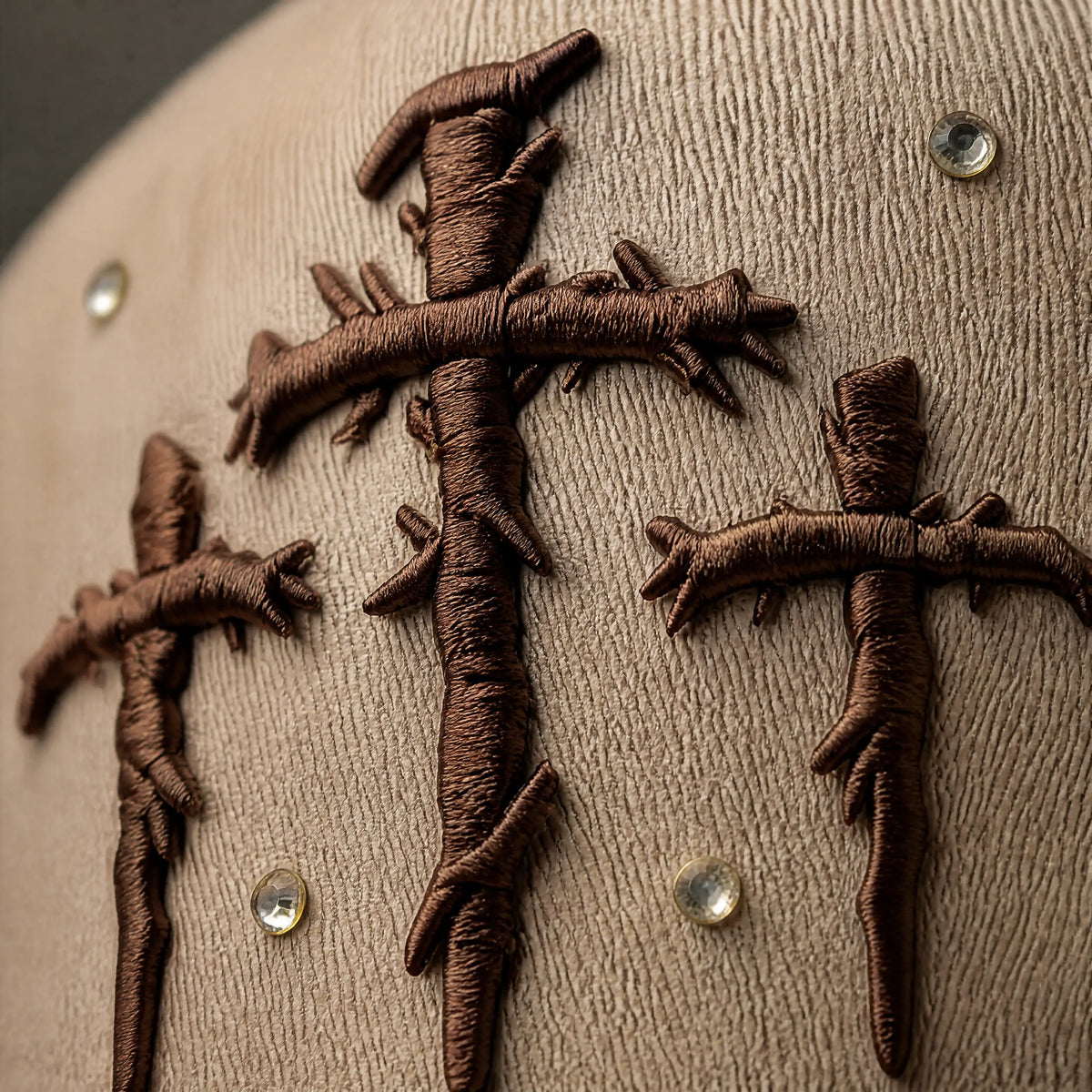 Close-up of embroidered Triple Cross Hat detail