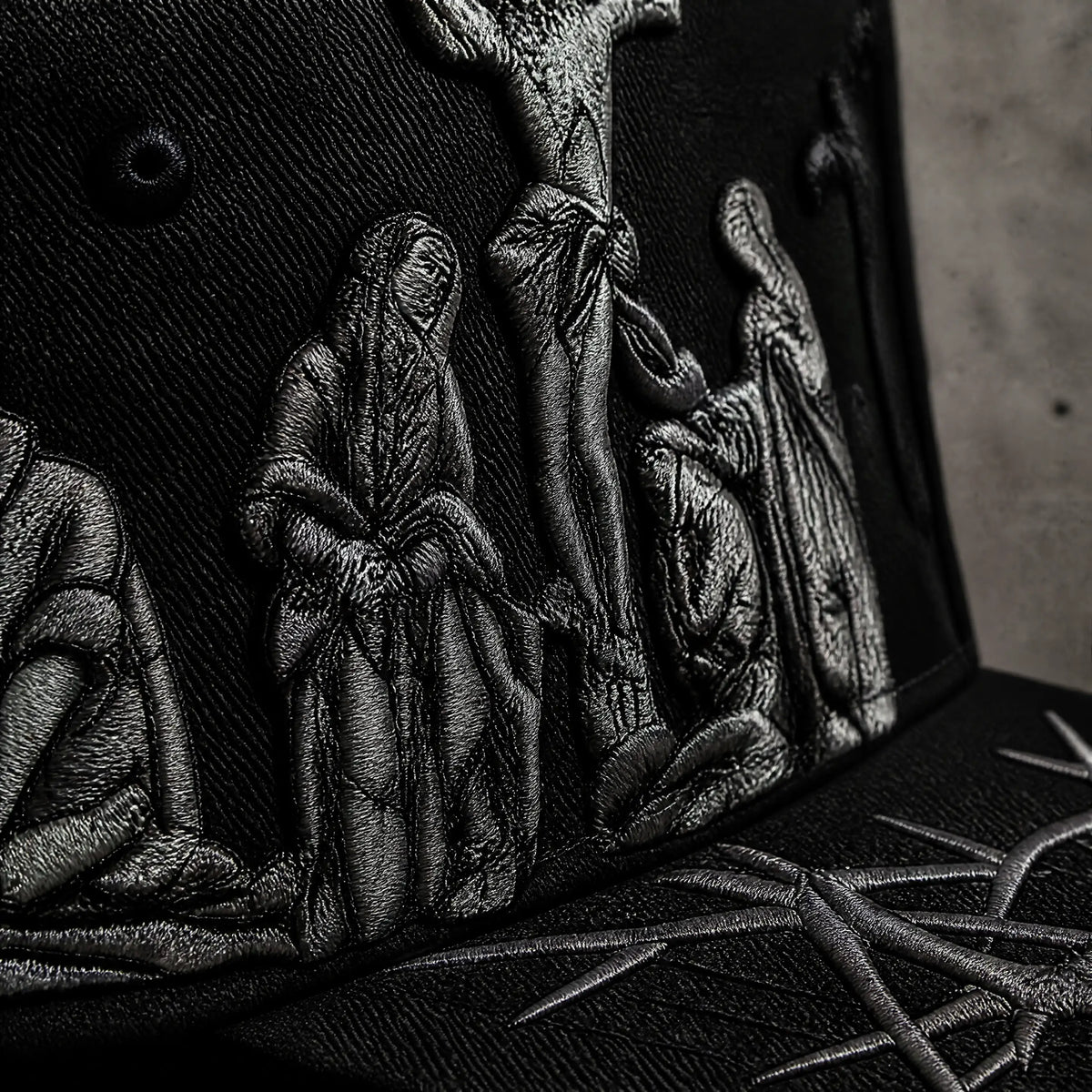 Close-up of embroidered Triple Cross Hat detail